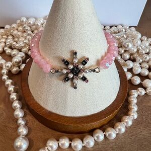Elegant Pink Beaded Bracelet with Starburst Charm